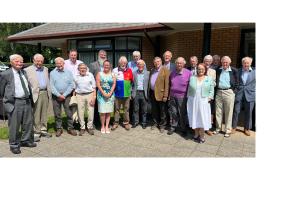 Club President Angus receives the award from District Governor Martin Bye